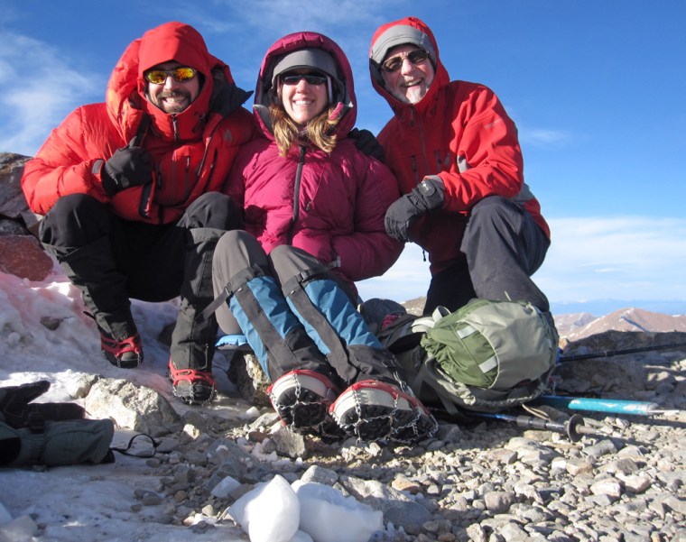On the summit with Doug and his dad in my super warm puffy down jacket.