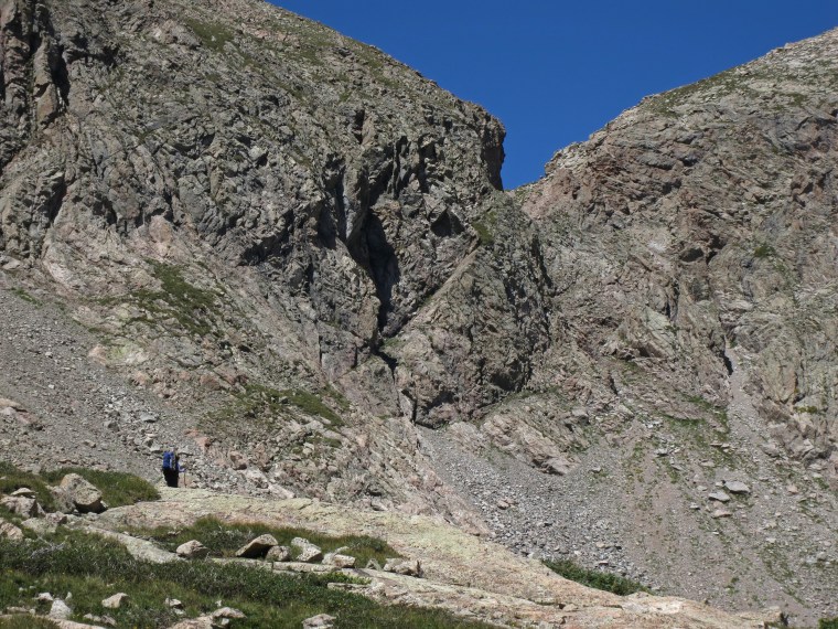 Doug and I descended the steep gully below the notch in this photo on day seven of the trip. It was essential to keep our packs as light as possible in such terrain.